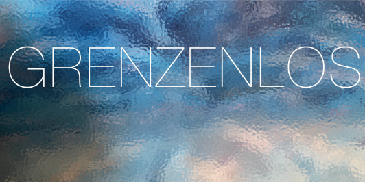 Text: Grenzenlos
Hintergrund: Reflektionen auf trüber Glasfläche